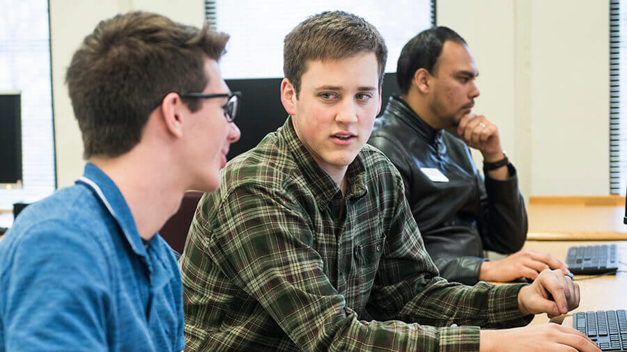 Two students collaborating in the computer lab