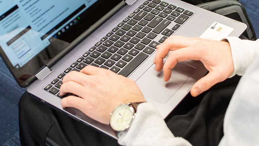 Hands on a laptop
