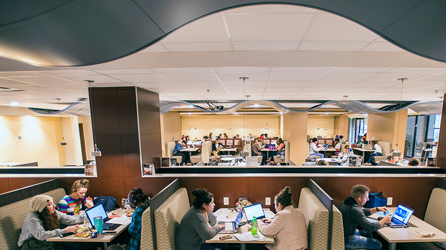 Students eat and chat in the cafeteria.