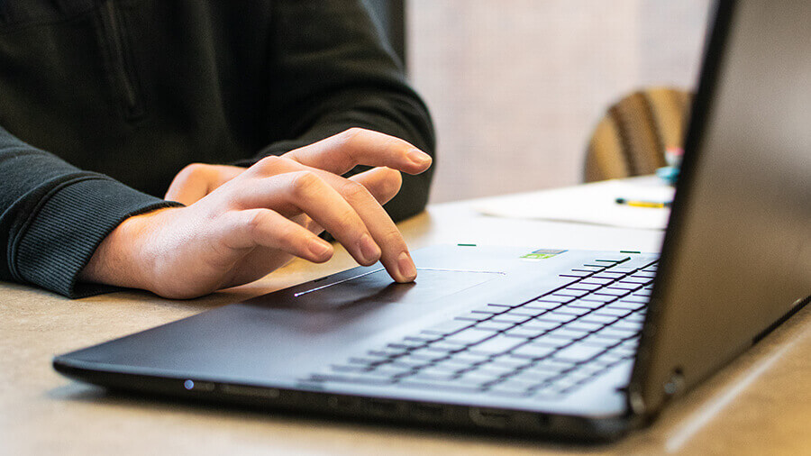 Employee typing on a computer