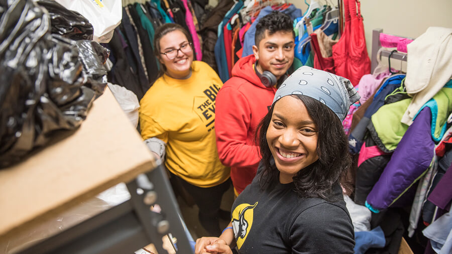 Students working on cleaning a closet during THE Big Event.