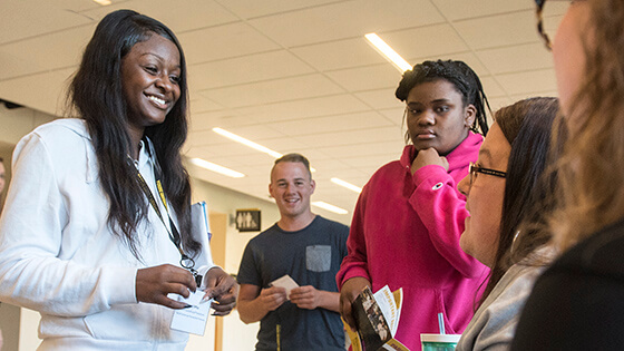 Prospective students check in during an accelerated admissions day.