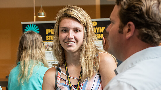 A student speaks with an academic advisor.