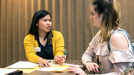 A student discusses degree options with an admissions advisor.