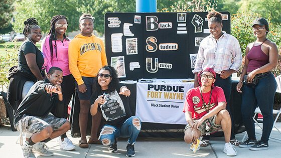 Members of a student organization tell new students about their group.