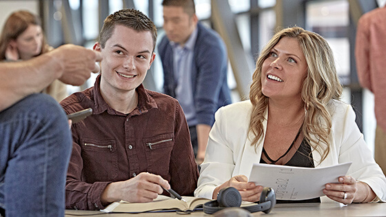 Returning students study in the Walb Union skybridge.