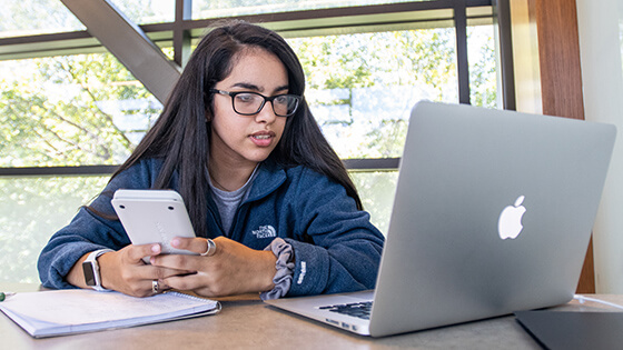 A student reviews financial aid options.