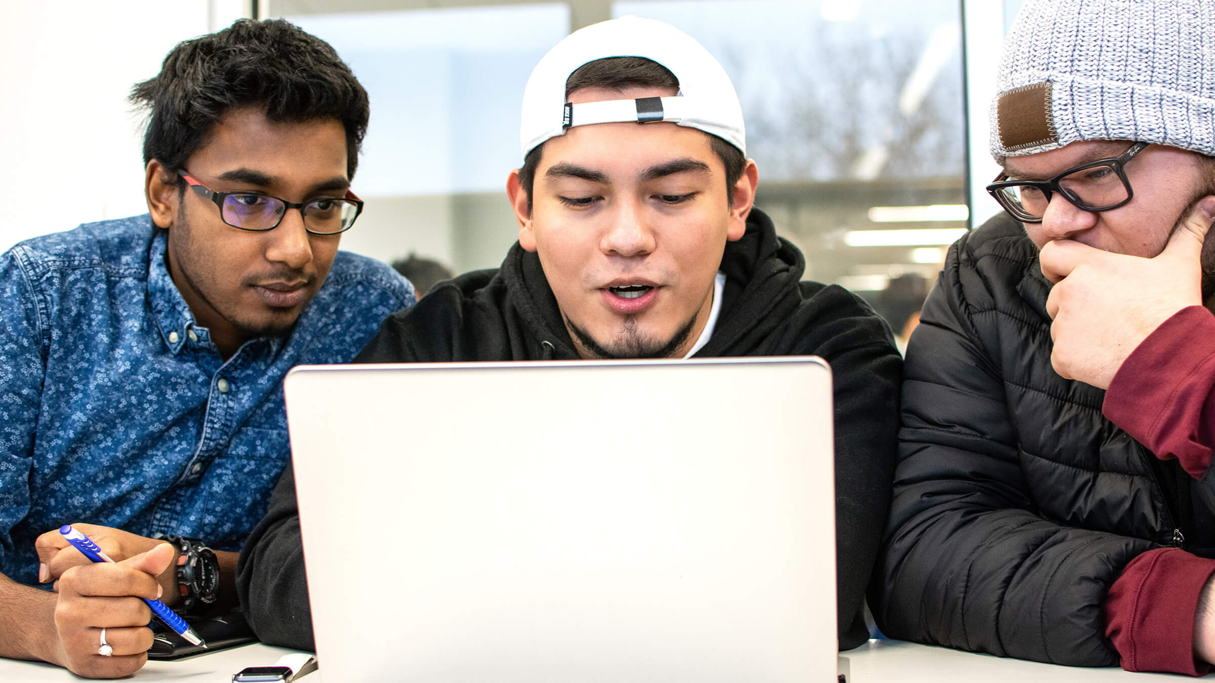 Students review scholarship information that they found online.