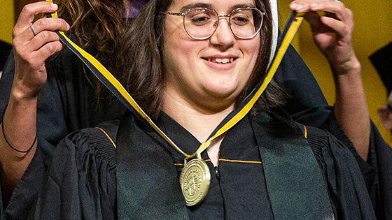 A PFW honor student gets recognition at commencement.