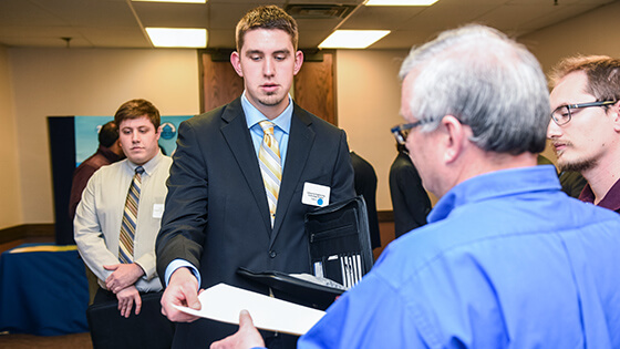 A student presents a résumé.