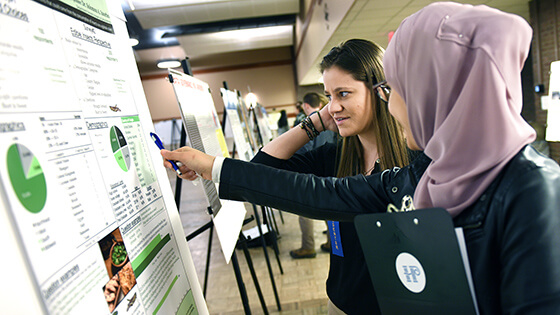 Student presenting research