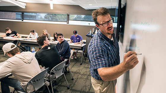 A professor leads a class discussion.