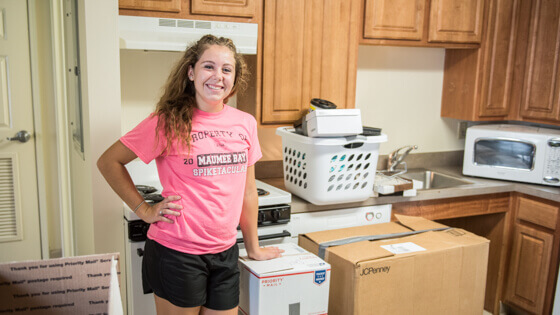Student moving into campus housing on move in day