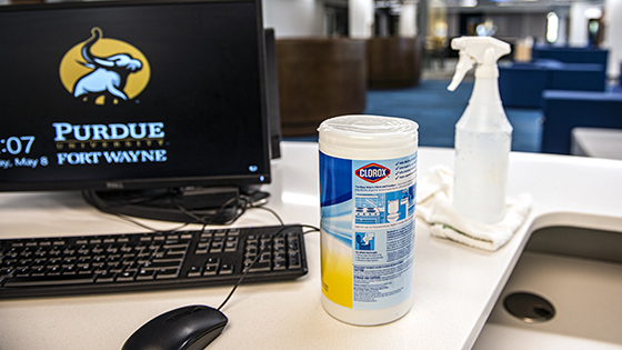 Purdue Fort Wayne campus computer with cleaning supplies on the desk