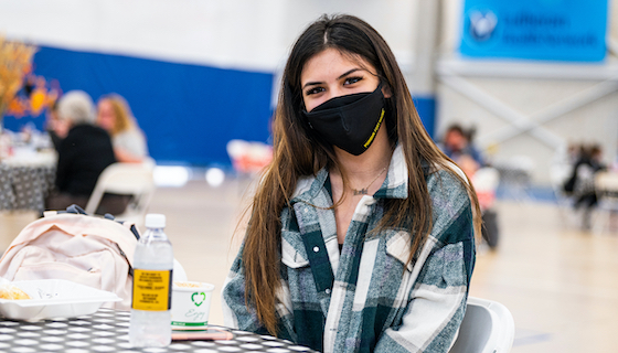 A student wears a mask while attending the Chancellor's Chili Fest.