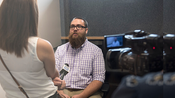 On camera interview with a news anchor.