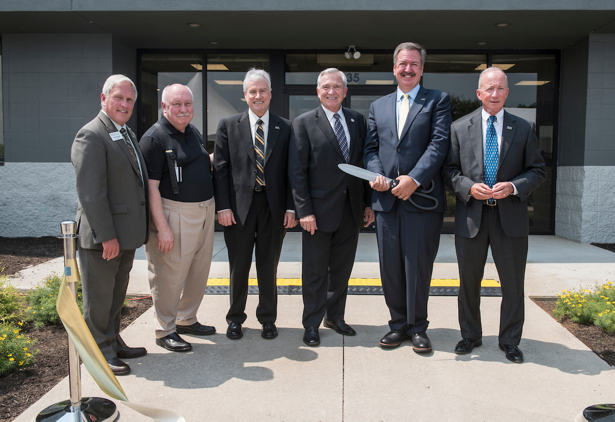 A group of graduates with a donor