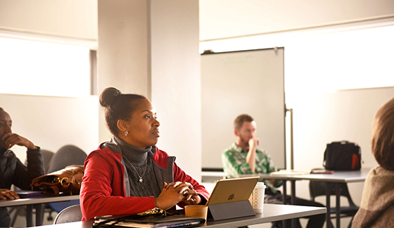 Several students listen during a lecture.