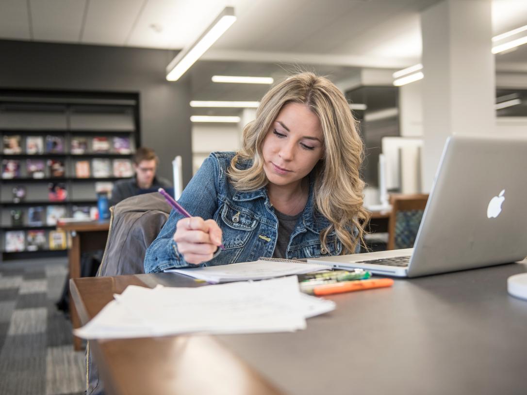Student studying in the library.