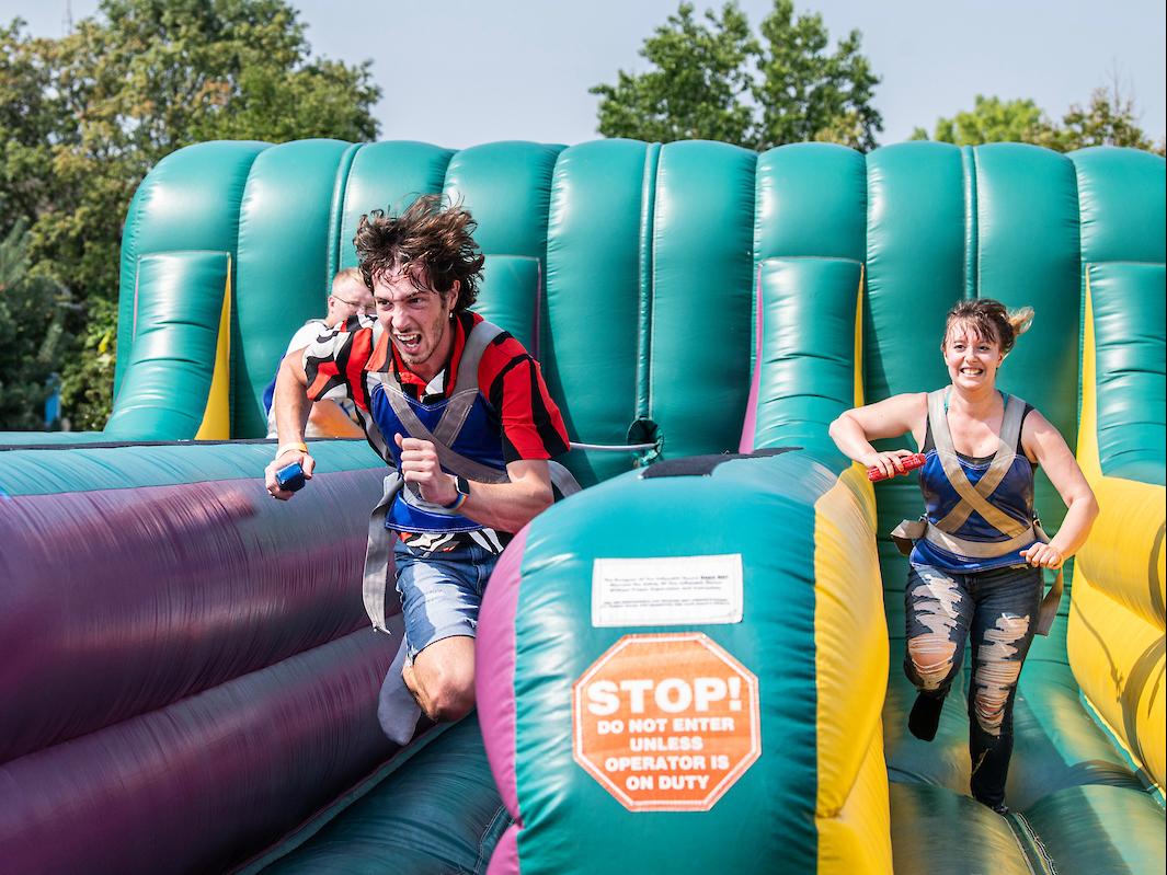 Students playing a racing game during Campus Kickoff.