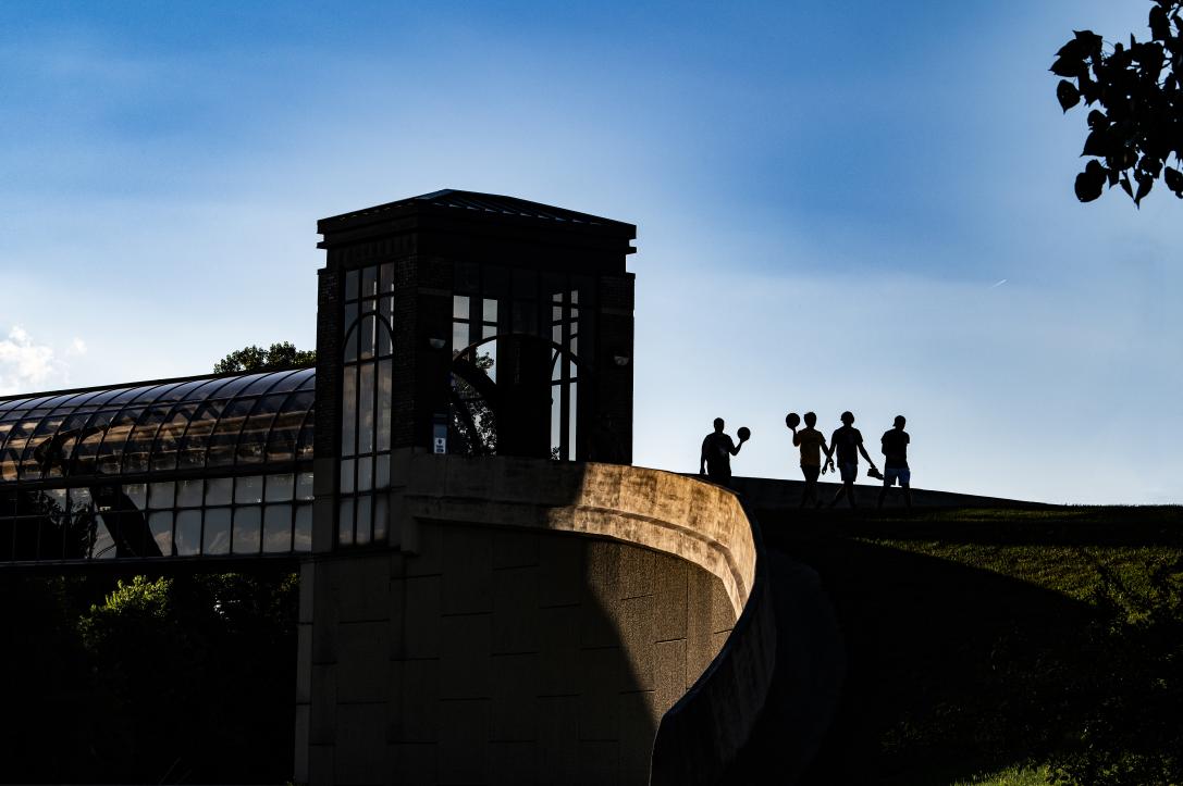 photo of the pedestrian bridge over Crescent Avenue. features students