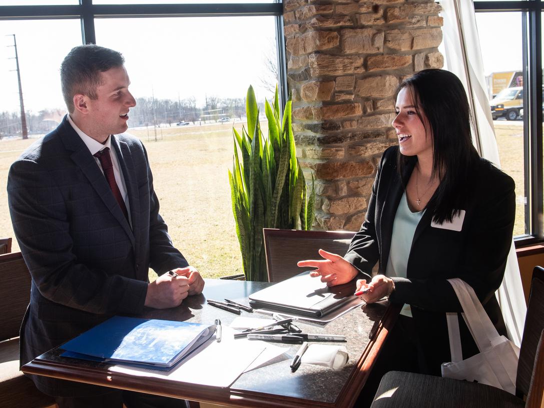 A discussion at an ETCS CS job fair at the Alumni Center