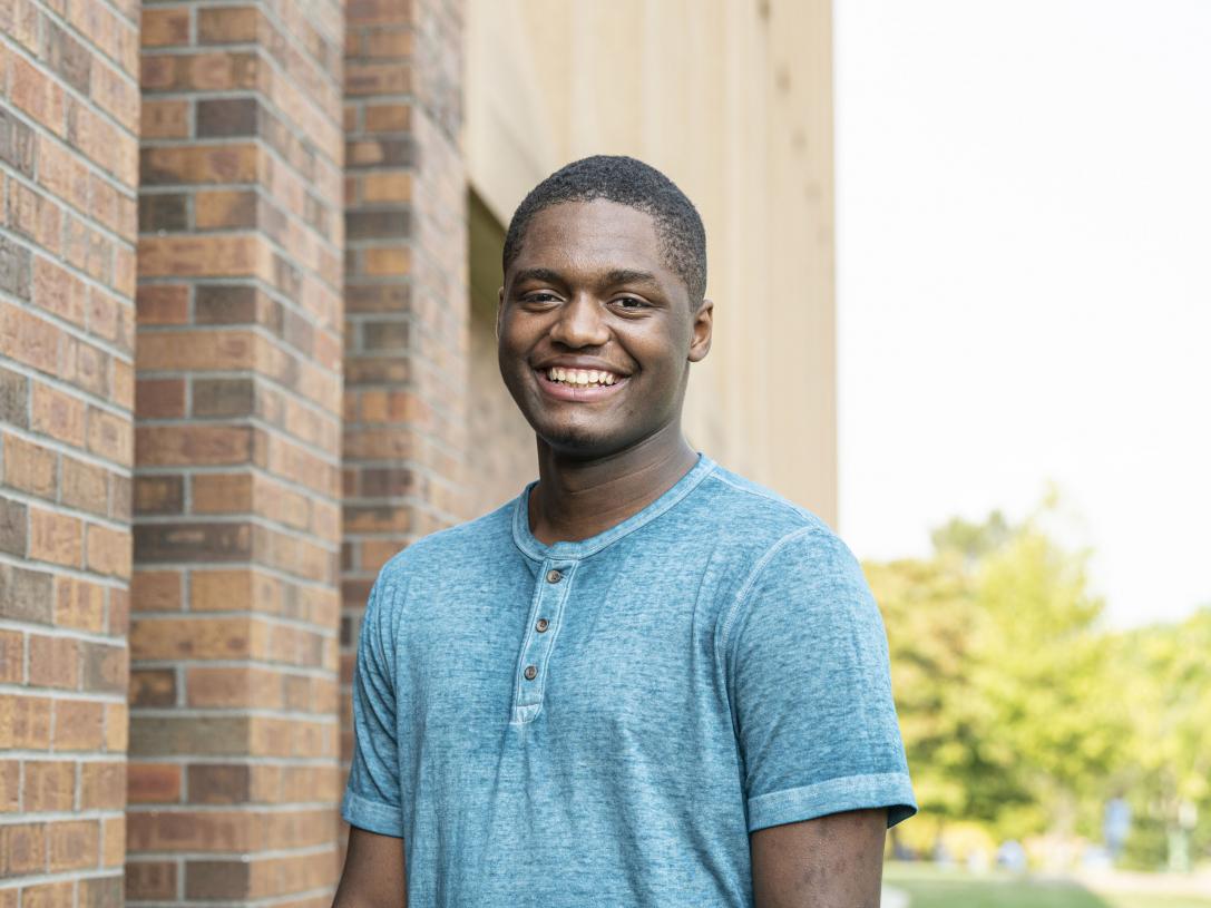 Male student posing outdoors.