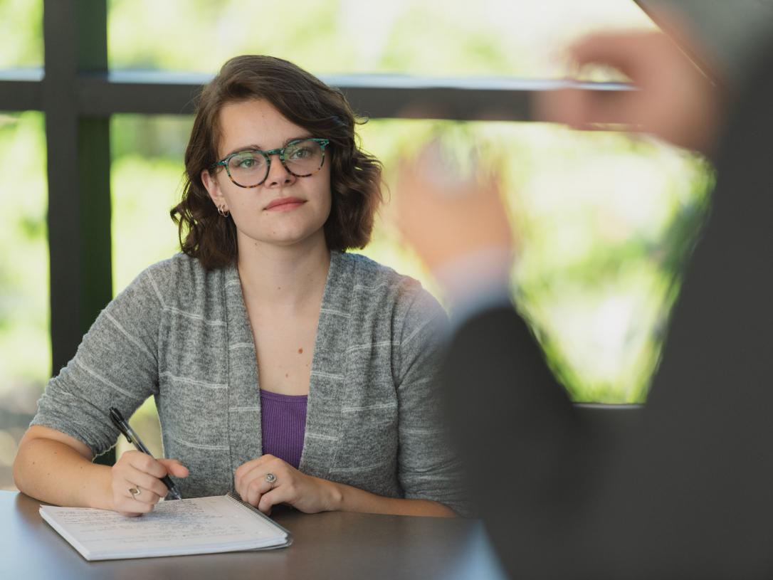 Student listening to lecture.