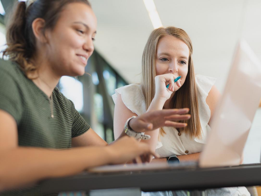 Female students studying indoors.