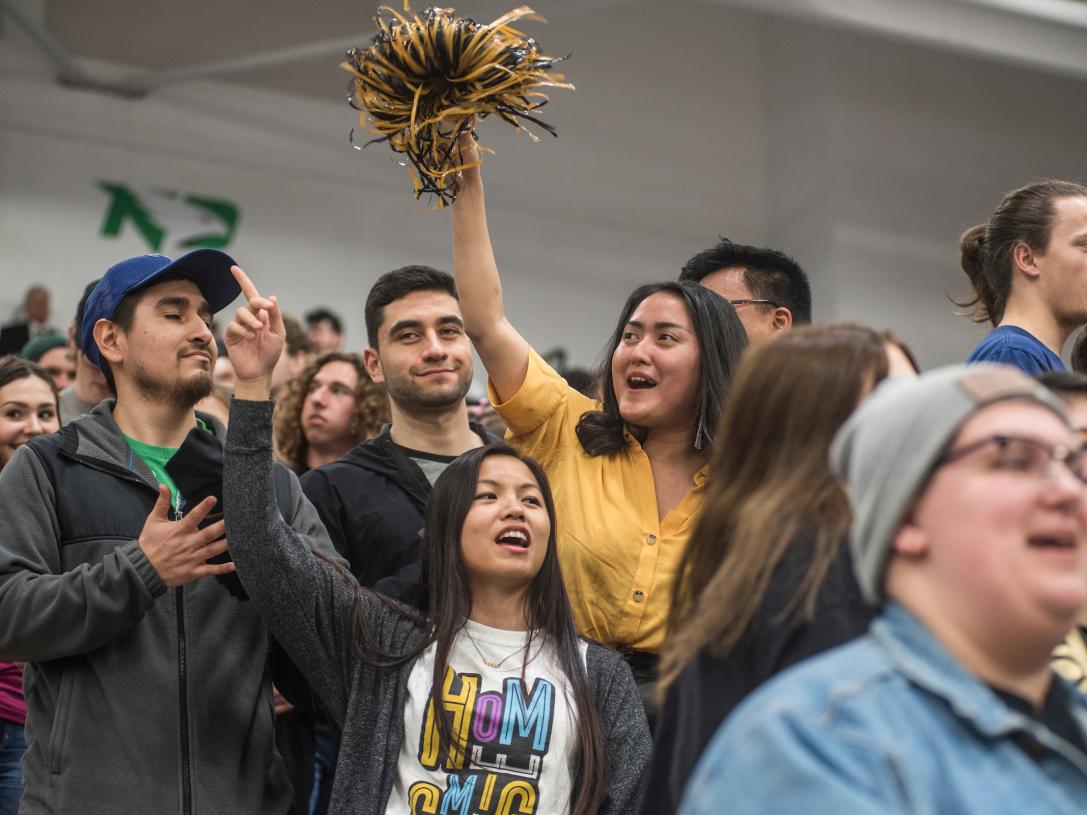 Students cheering at homecoming.