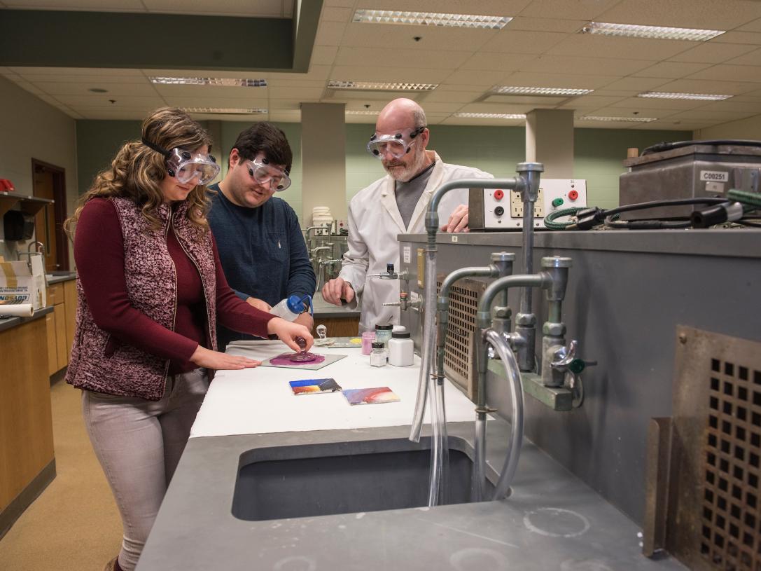Students and professor in lab