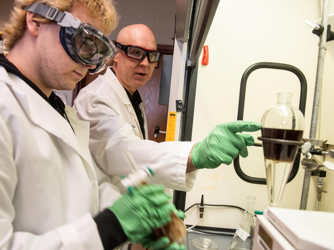 Student and professor in a lab
