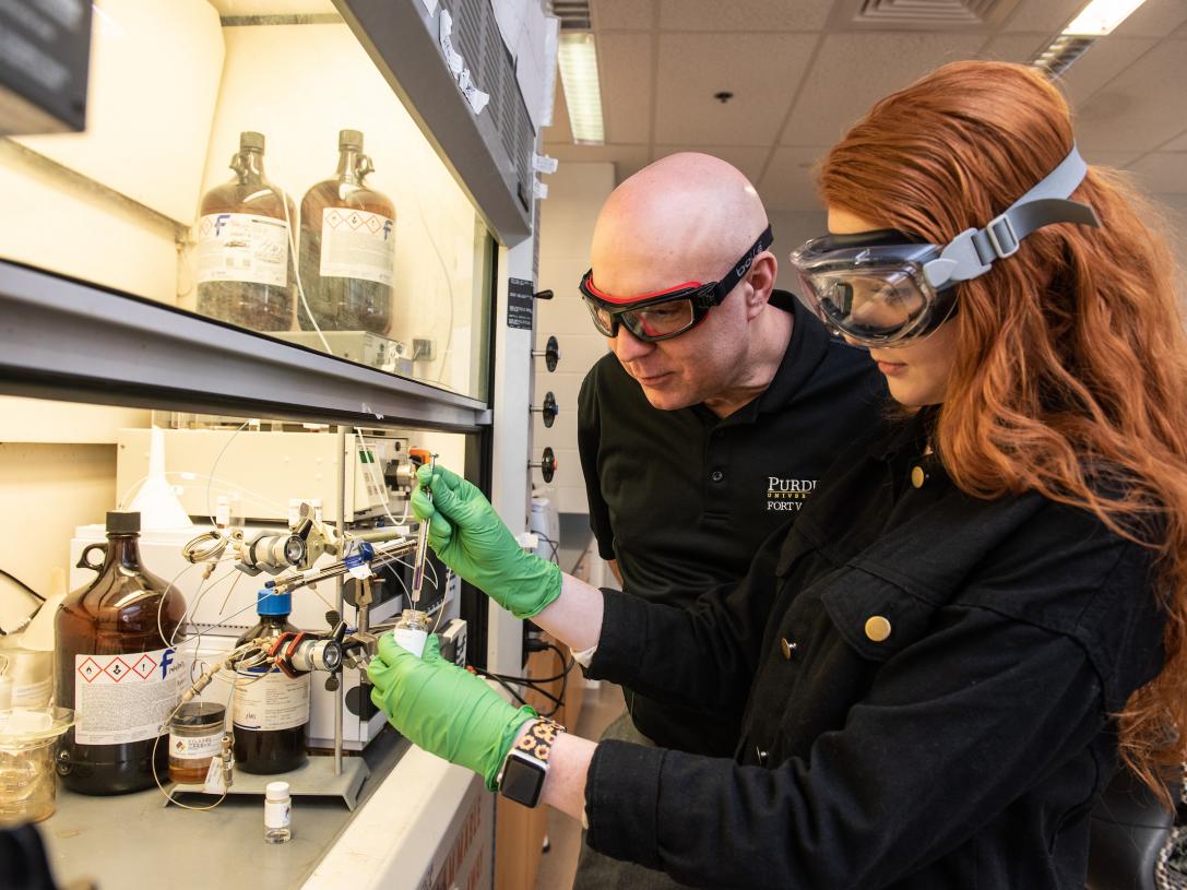 Student and professor in a lab