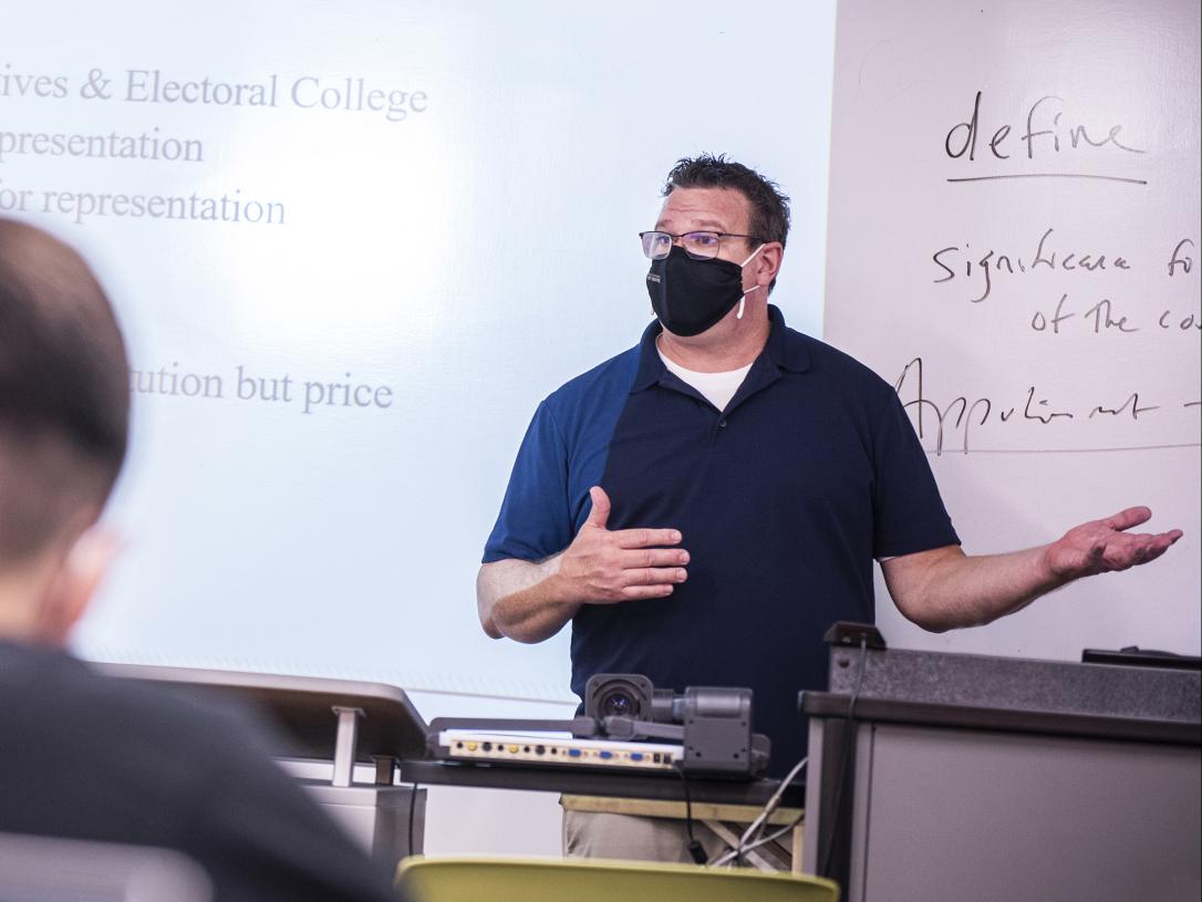 Political Science professor Mike Wolf instructs a class