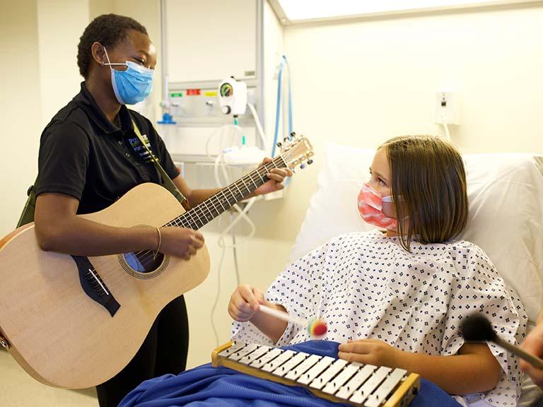 Part of Zana Mlotshwa's undergraduate training as music therapy undergrad at Purdue Fort Wayne includes interactions with patients that are designed to bring normalization and expression to a healthcare setting