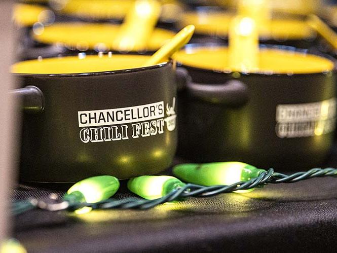 Large black and gold mugs imprinted with the PFW logo