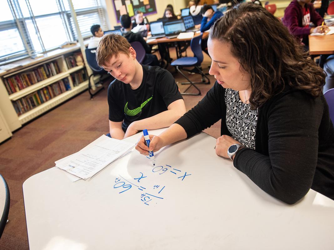 Student and teacher doing math
