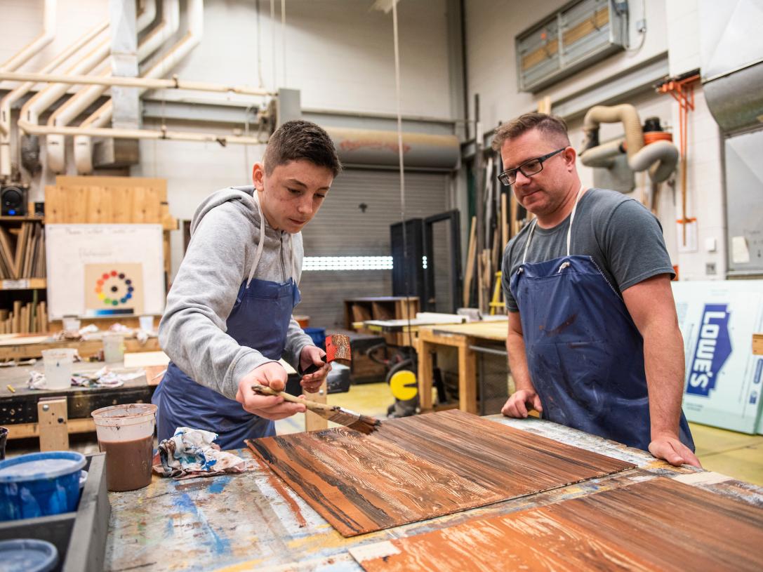 Student working on a theatre set