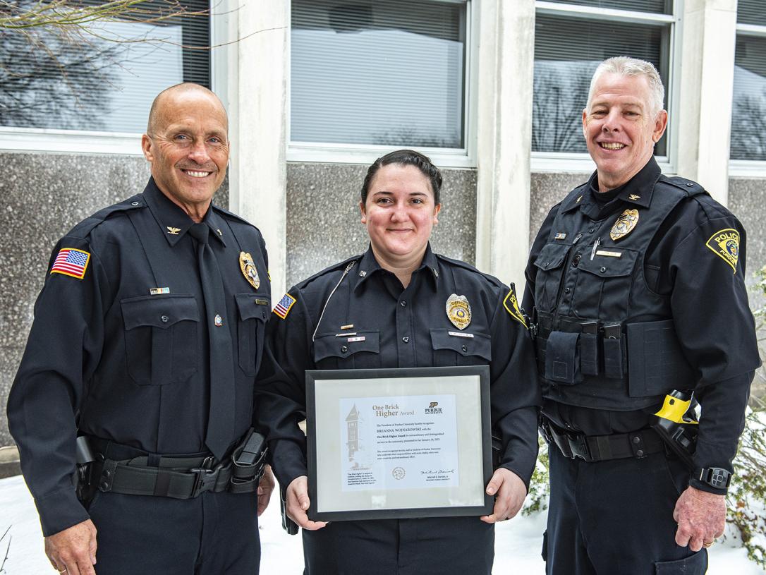 Chief Tim Potts, Officer Breanna Wojnarowski, and Chief John Cox