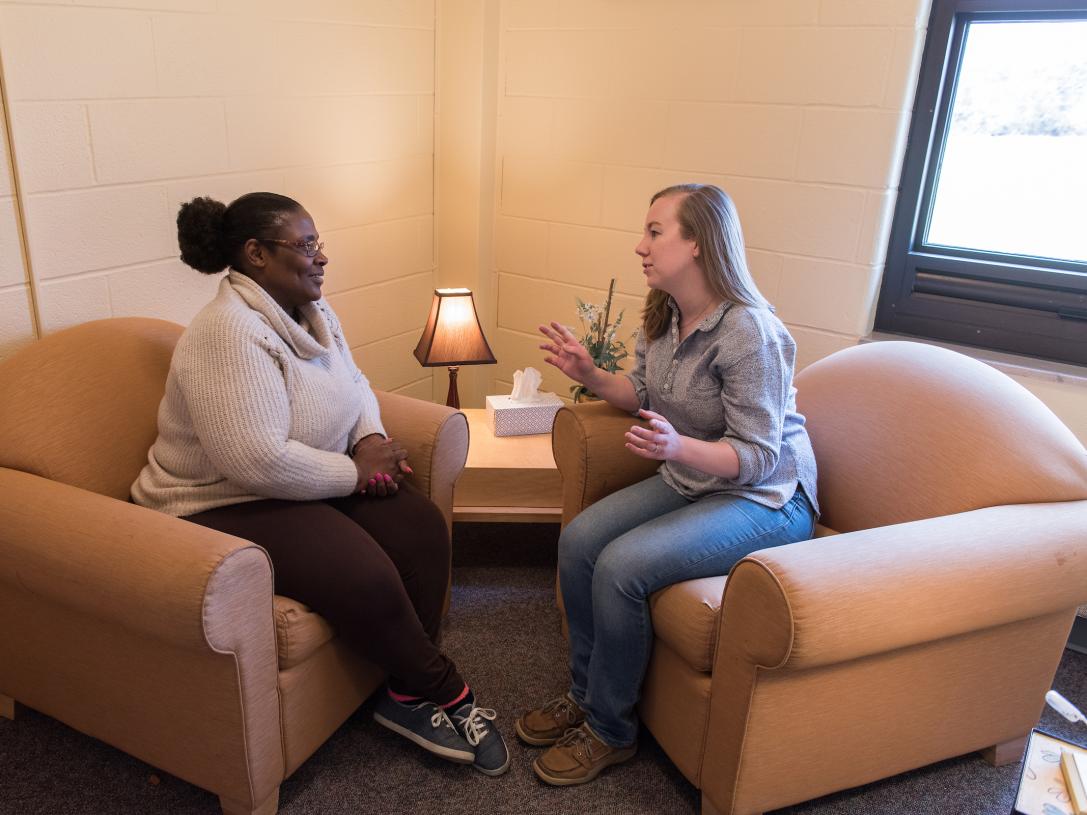 A PFW counseling student works with a client in the counseling center.