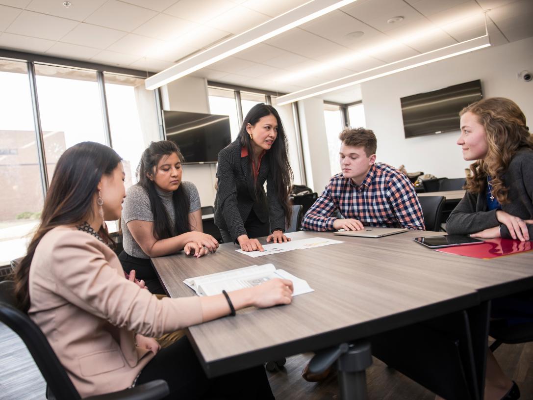 Business students utilize campus meeting spaces.