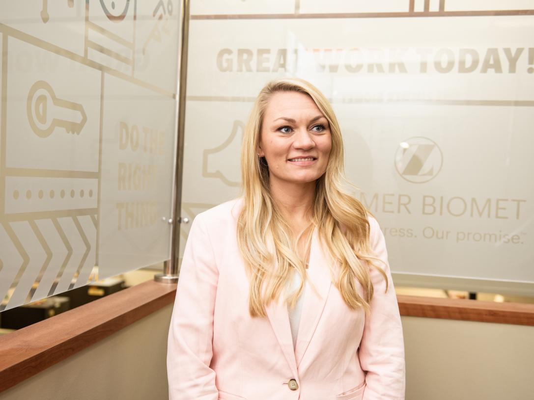 Student poses at an internship.