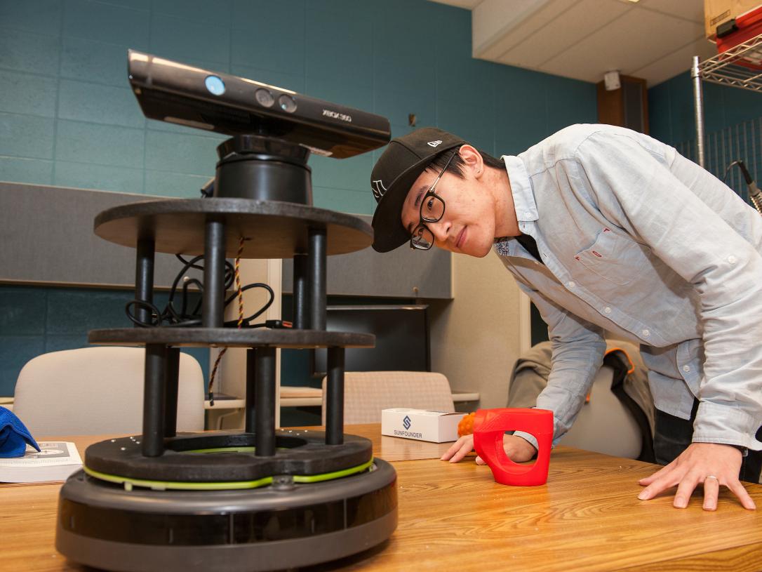 Student looking at equipment