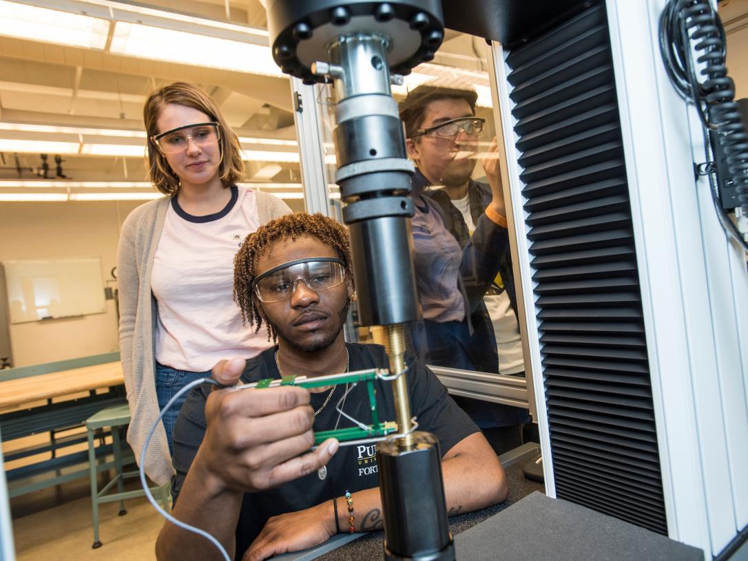 Students using equipment