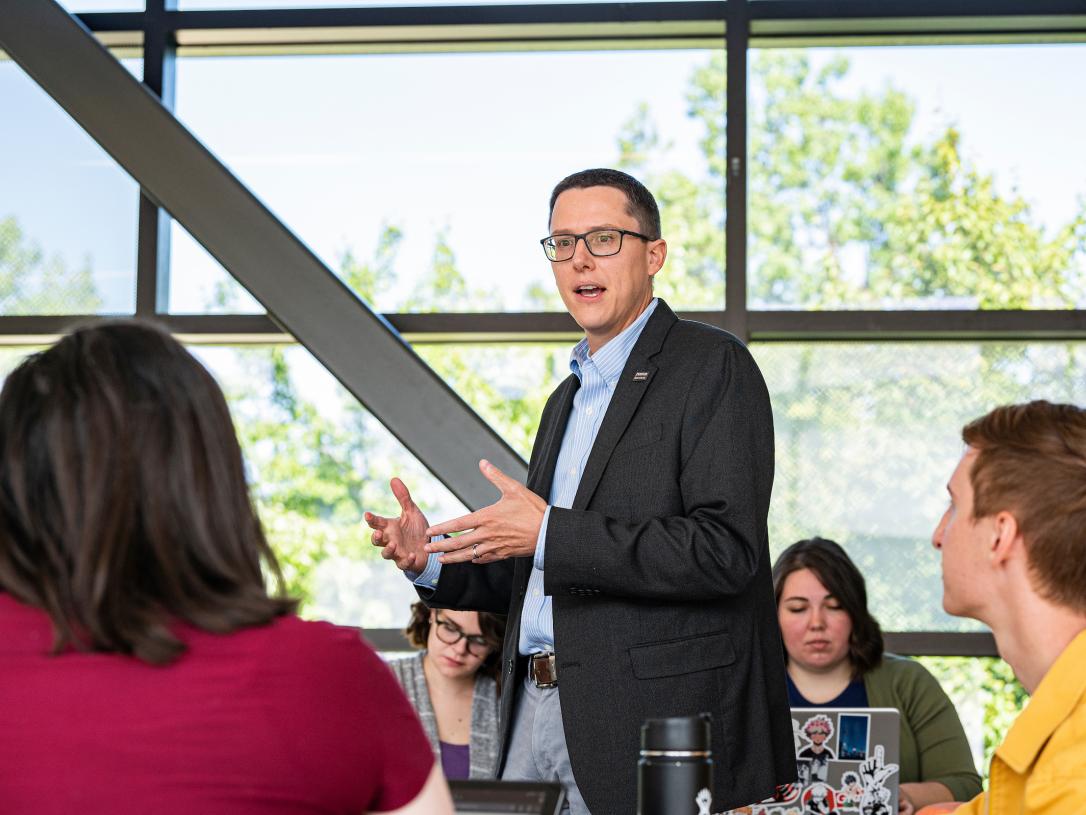 Students listen to a professor.