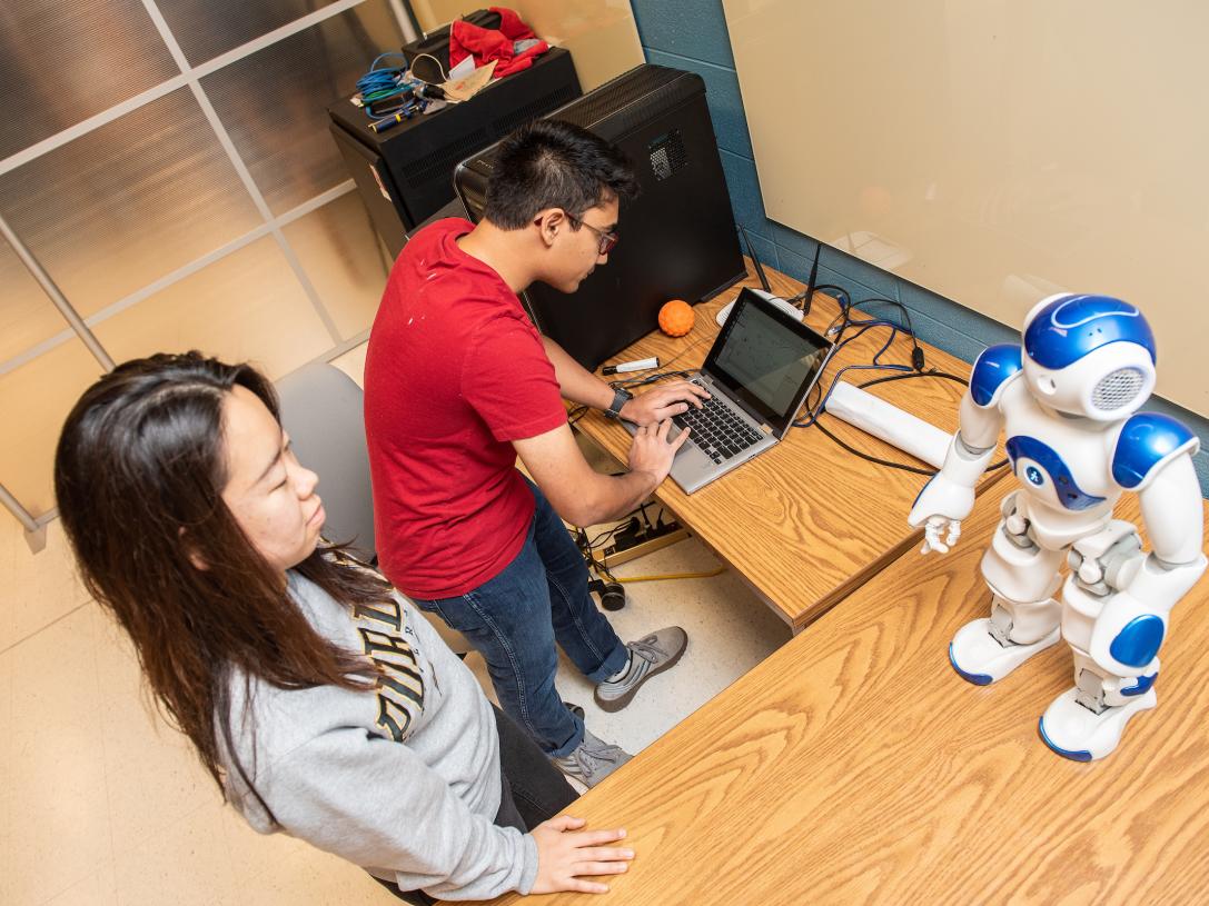 Students programming a robot