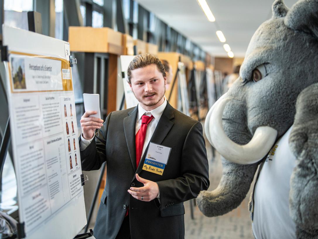 Student presenting poster
