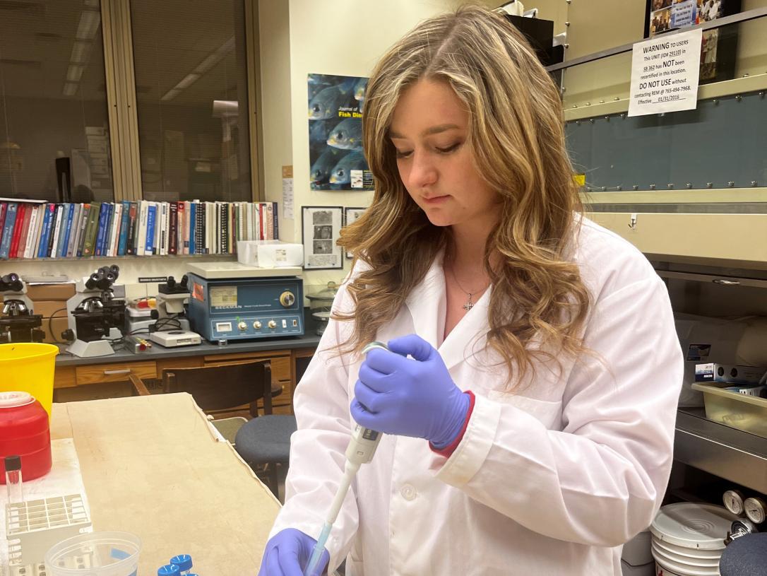 Taylor Schoenefeld, student, in a lab.