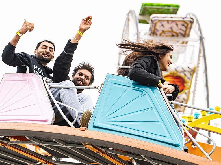 Students ride on the Casino carnival ride