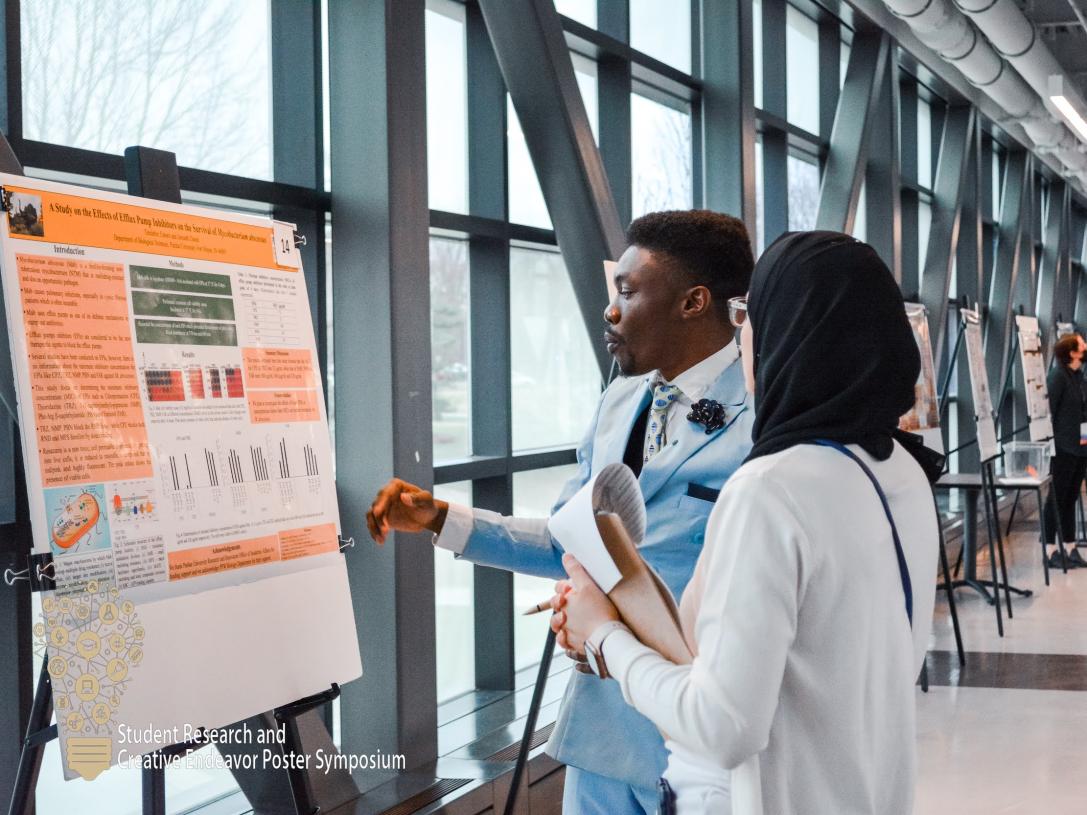 Student presents at the research symposium.